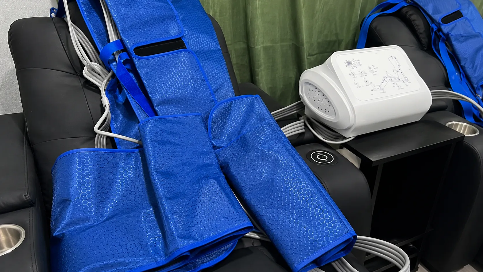 Blue sequential pneumatic compression therapy boots and machine ready for a session at 360 IV Infusion and Wellness in Prosper TX