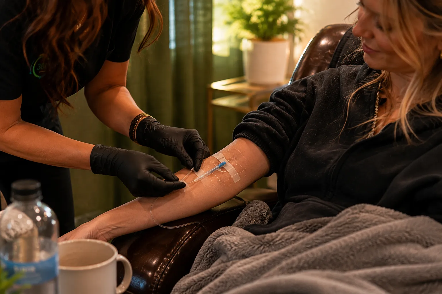 Skilled RN placing IV line for hydration therapy in Prosper TX with one clean stick technique