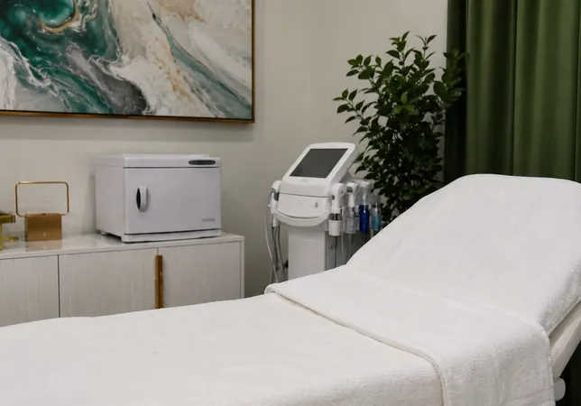 360 IV Infusion and Wellness treatment suite in Prosper TX with treatment bed, towel warmer, and aesthetic equipment