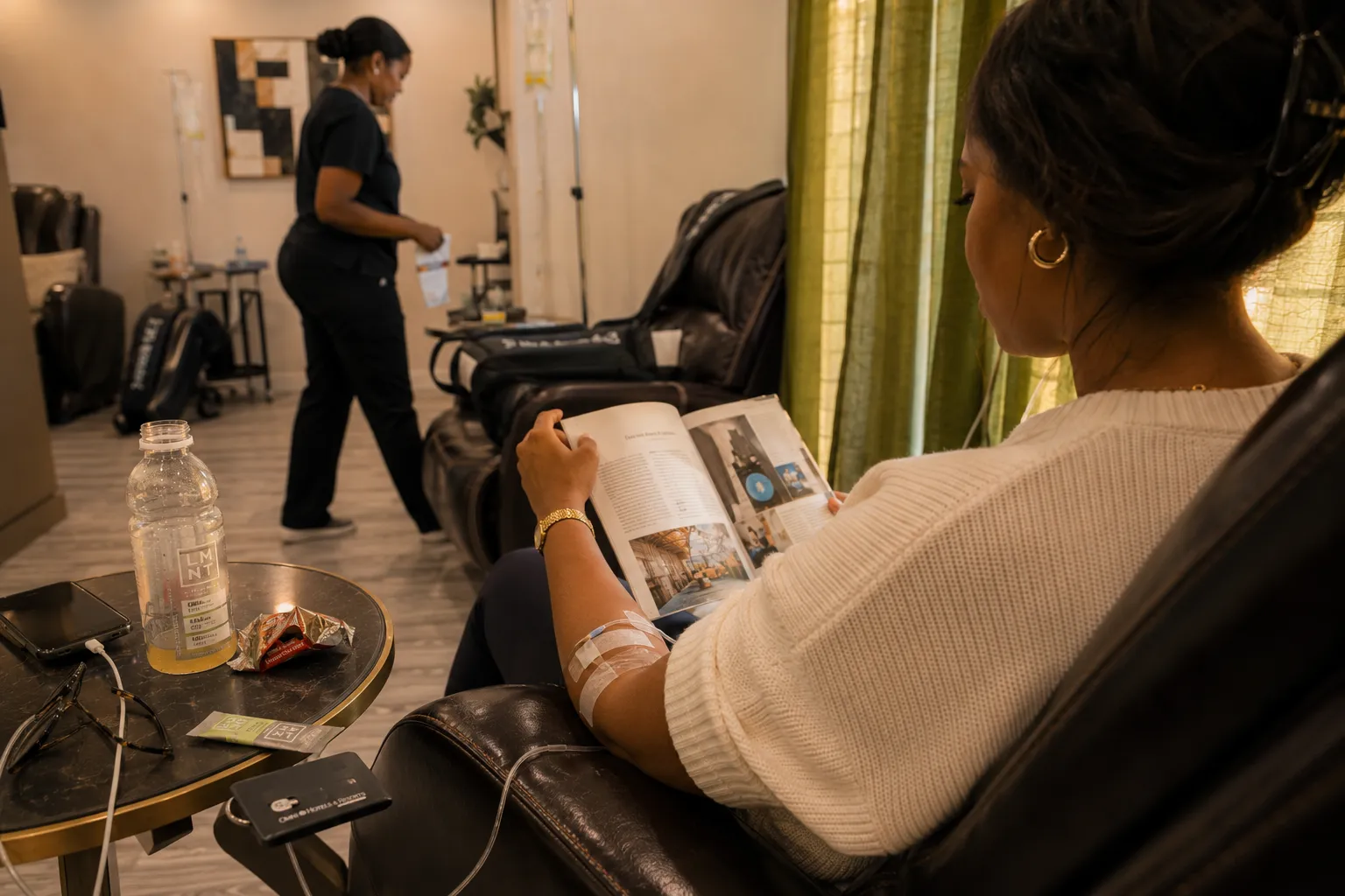 Private IV suite at 360 IV Infusion and Wellness — massage chair, IV setup, RN preparing infusion near Omni PGA Frisco